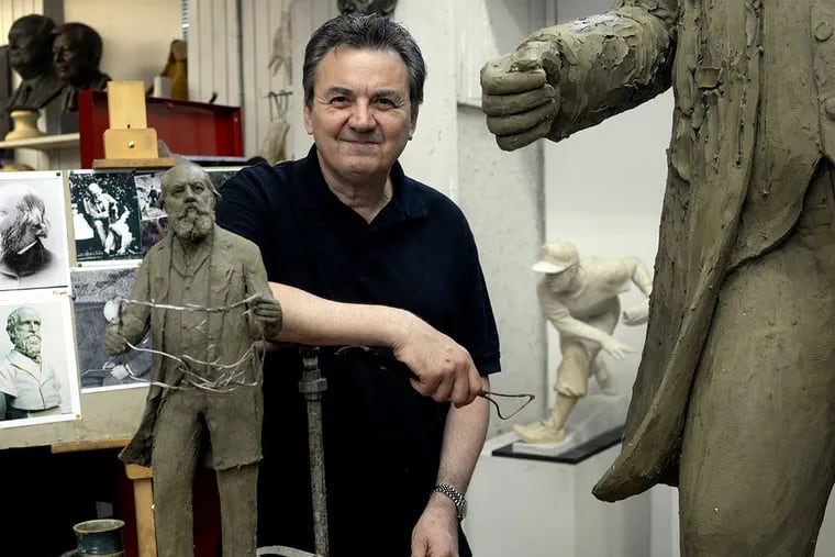 Frudakis with a model of the 8-foot-tall sculpture at his studio in Glenside. (Ben Mikesell/Staff Photographer)