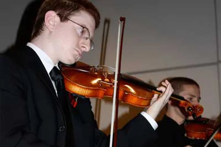Tyler Clementi in 2009 playing with Ridgewood High School Orchestra.  The Rutgers student jumped to his death after authorities say classmates recorded him having sex. (AP Photo/The Record of Bergen County, Ryan Pifher)