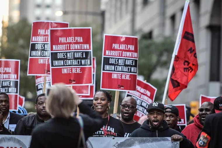 In October, Marriott workers, including chef Lekesha Wheelings (center), rallied outside the Philadelphia Marriott Downtown as they demanded the hotel company sign an agreement saying it would not interfere with the unionization process with UNITE HERE.