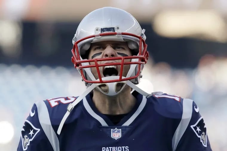 New England Patriots quarterback Tom Brady gives a shout as he takes the field to warm up before the AFC championship NFL football game against the Jacksonville Jaguars, Sunday, Jan. 21, 2018, in Foxborough, Mass.