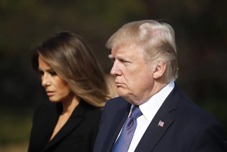 U.S. President Donald Trump, right, and first lady Melania Trump, left, arrive at the National Cemetery in Seoul, South Korea, Wednesday, Nov. 8, 2017.