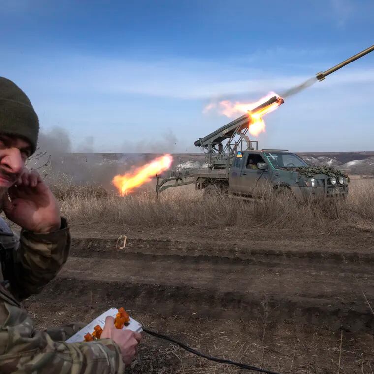 A Ukrainian officer from the 56th Separate Motorized Infantry Mariupol Brigade fires a multiple launch rocket system based on a pickup truck towards Russian positions at the front line, near Bakhmut, Donetsk region, Ukraine, in March. The outgunned and outnumbered Ukrainian troops are increasingly struggling to halt Russian advances as a new U.S. aid package has remained stuck in Congress.