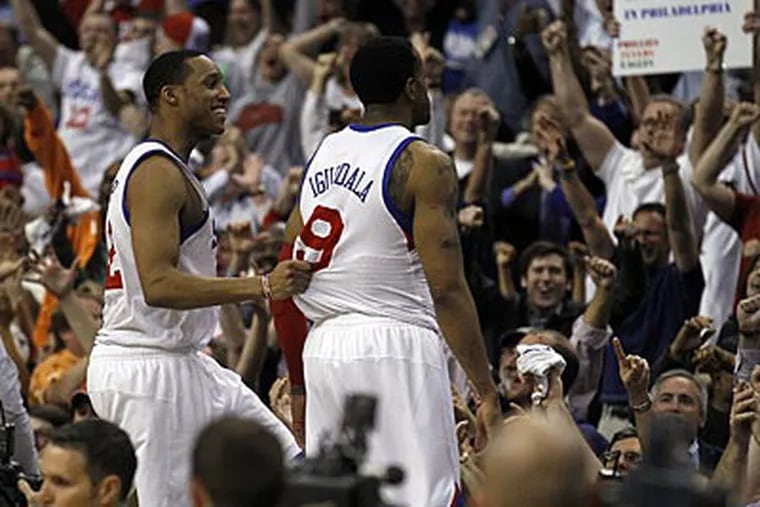 Evan Turner and Andre Iguodala celebrate the 76ers' Game 6 win over the Bulls on Thursday. (Yong Kim/Staff Photographer)