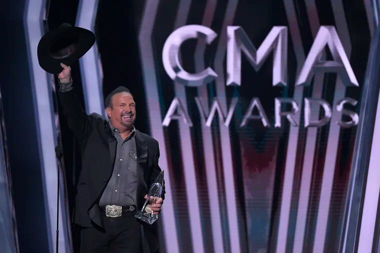 Garth Brooks accepts the award for Entertainer of the Year at the 53rd annual CMA Awards at Bridgestone Arena on Wednesday in Nashville, Tenn.