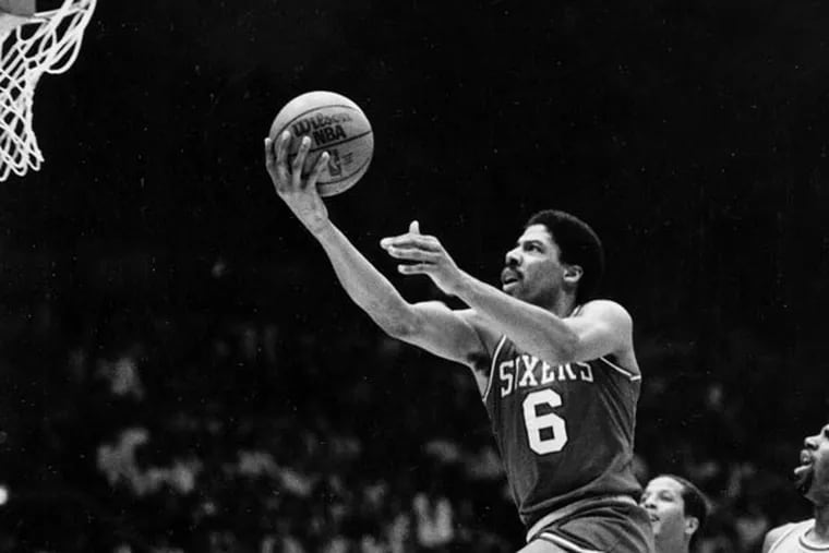 In this May 31, 1983 file photo, Philadelphia 76ers center Julius "Dr. J" Erving goes up for two points near the end an NBA Championship playoff game against the Los Angeles Lakers in Los Angeles. (AP file photo)