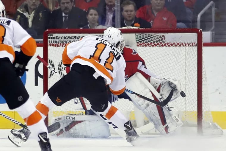 Washington goaltender Braden Holtby catches a shot by Flyers winger Travis Konecny on Wednesday. Konecny later scored for the fifth straight game.