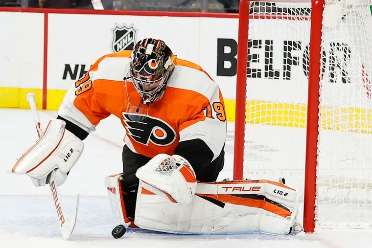 Flyers goaltender Carter Hart gets ready to cover the puck against the Boston Bruins in a preseason game Oct. 4. The Flyers won in OT, 2-1. Hart was extremely sharp in two preseason outings.