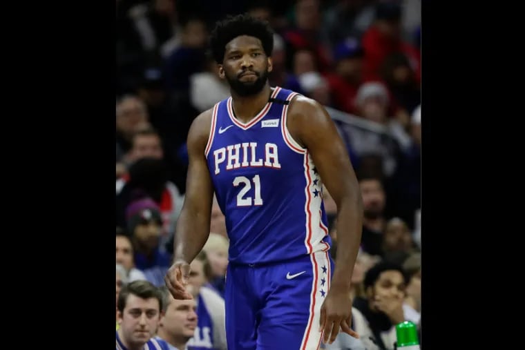 Sixers center Joel Embiid reacts after injuring his finger during the first quarter against the Oklahoma City Thunder on Monday.