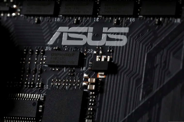 This Feb 23, 2019, photo shows the inside of a computer with the ASUS logo in Jersey City, N.J. Security researchers say hackers infected tens of thousands of computers from the Taiwanese vendor ASUS with malicious software for months last year through the company’s online automatic update service. Kaspersky Labs said Monday, March 25, that the exploit likely affected more than 1 million computers from the world’s No. 5 computer company, though it was designed to surgically install a backdoor in a much smaller number of PCs. (AP Photo/Jenny Kane)