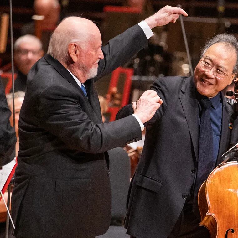 Composer John Williams (left) directs the applause to Yo-Yo Ma after the cellist performed Williams' "Cello Concerto" with the Philadelphia Orchestra in Verizon Hall on Feb. 20, 2024.