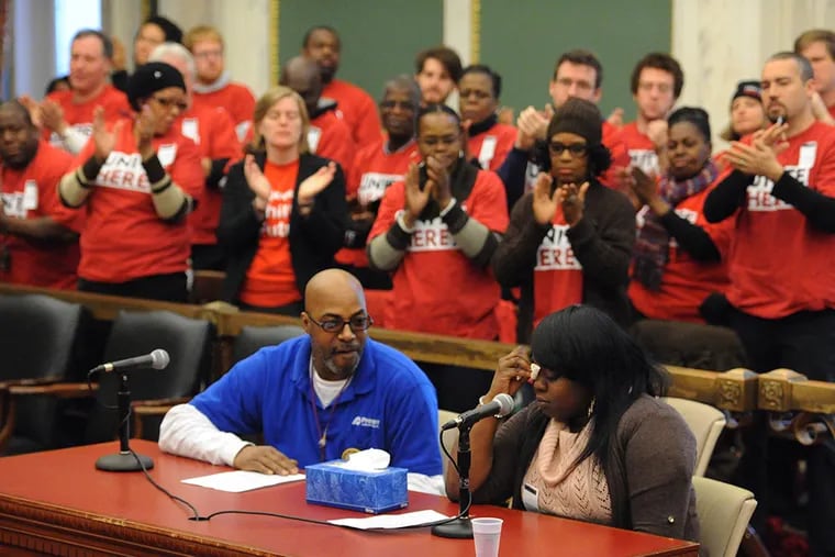 An emotional Misha Williams receives a standing ovation in City Council after she testified before a hearing by Council's Committee on Commerce on Economic Development concerning labor peace at Philadelphia International Airport on Nov. 19, 2014. ( CLEM MURRAY / Staff Photographer )