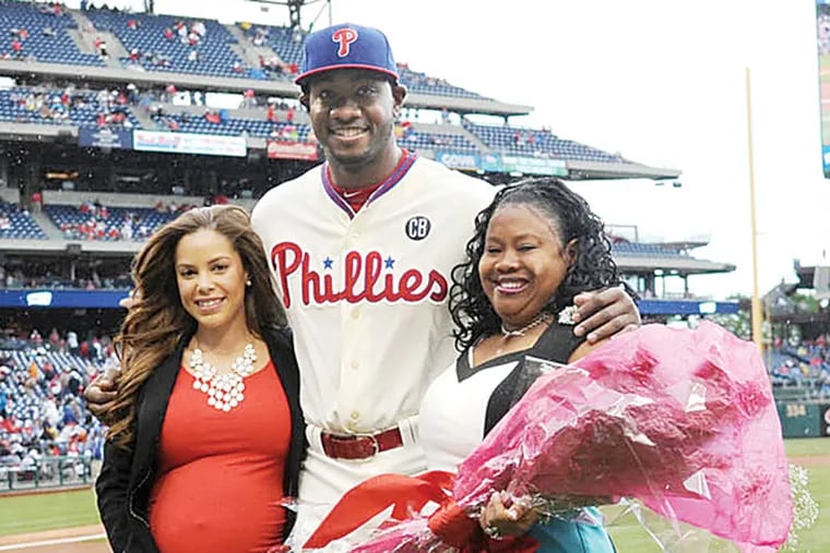 Phillies left fielder Domonic Brown, with mom Rose Mary Woods (right) and girlfriend Stephanie Gayle, on Sunday, May 4, at Citizens Bank Park.