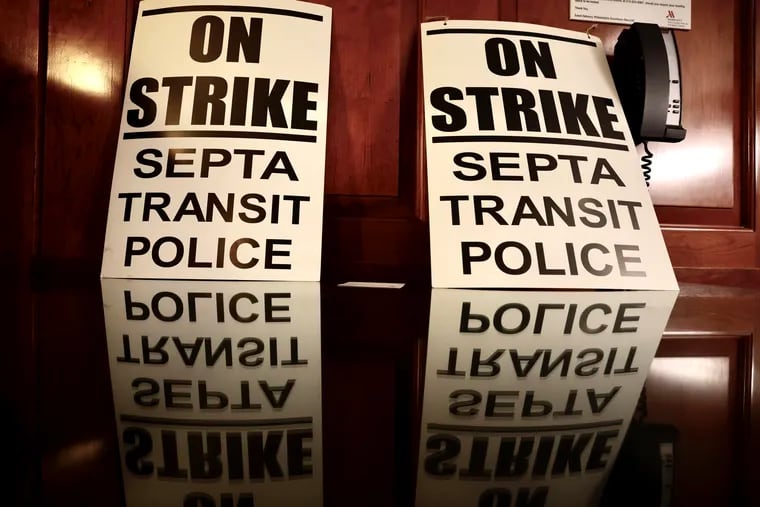 Strike signs at a news conference announcing that SEPTA transit police are on strike in Philadelphia on Wednesday, Dec. 13, 2023.