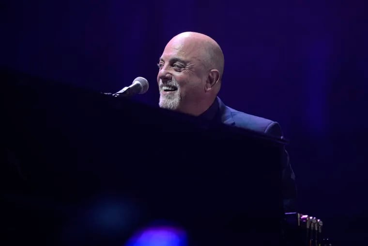 Billy Joel sings and plays the piano during his concert Aug. 13, 2015, at Citizens Bank Park.  ( BEN MIKESELL / Staff Photographer )