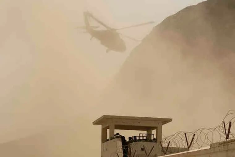 A Black Hawk helicopter lifts off from a base in Kandahar, Afghanistan. Several coalition troops and civilian employees were wounded in an attack on the Kandahar Air Field on Saturday.