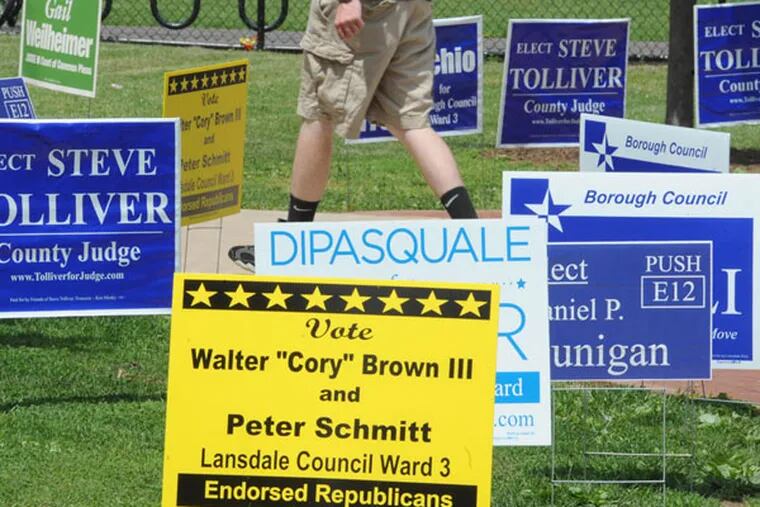 Primary election day in Pennsylvania Tuesday, May 21, 2013 as evidenced by campaign signs sprouting in front of the polling place at York Avenue Elementary School in Lansdale. CLEM MURRAY / Staff Photographer