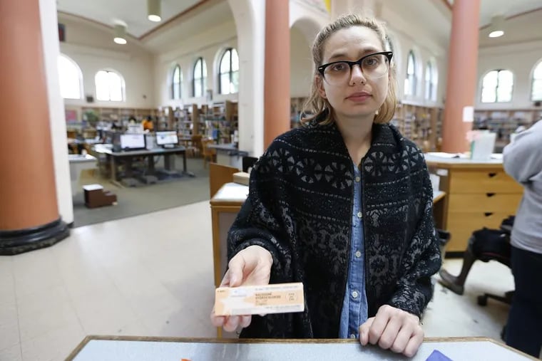 McPherson Square librarian Chera Kowalski poses with naloxone, which she had  to use earlier in the day to save a person who overdosed on heroin.