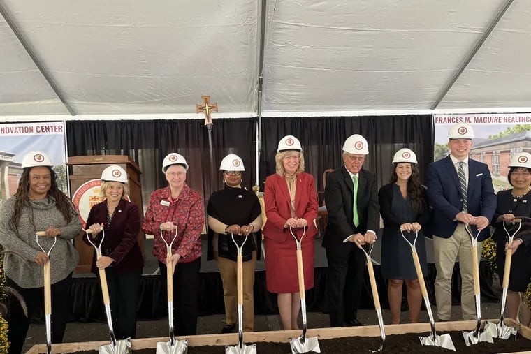 Gwynedd Mercy University officials and other dignitaries break ground on the Frances M. Maguire Healthcare Innovation Center, including James Maguire (fourth from the left) and university president Deanna D'Emilio (fifth from the left).
