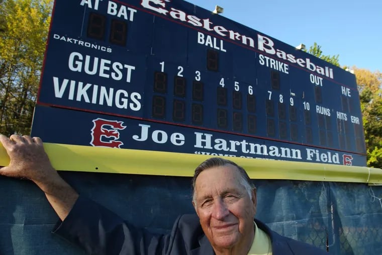 Joe Hartmann stands in front of the scoreboard at Eastern HIgh School on Tuesday, May 2, 2013. ( RON CORTES / Staff Photographer ) , The Joe Hartman Diamond Classic celebrates its 40 year this season