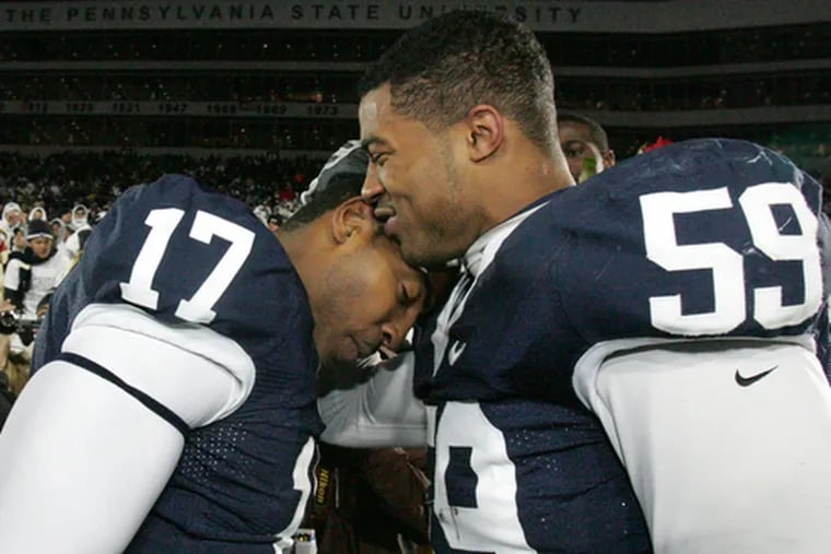 Aaron Maybin (right) celebrates Penn State&#0039;s win over Michigan State with quarterback Daryll Clark.