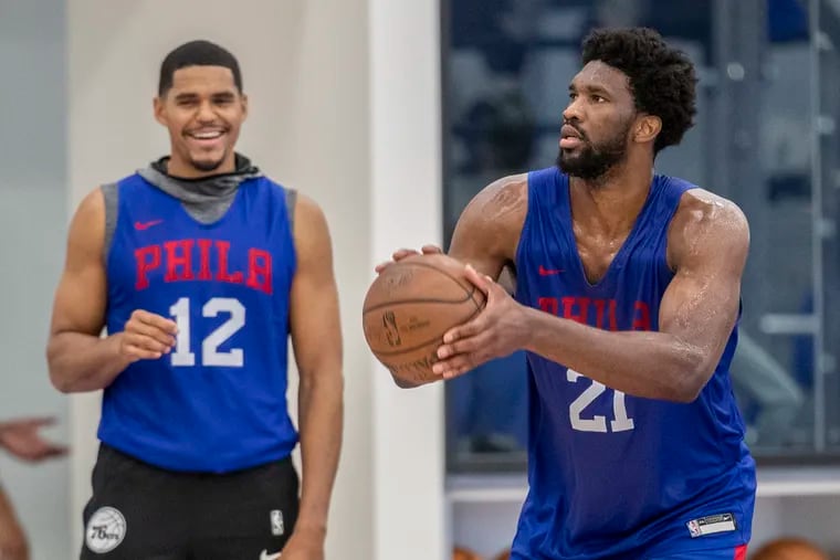 We may see Sixers center Joel Embiid, right, and Tobias Harris on the team's practice floor in Camden.