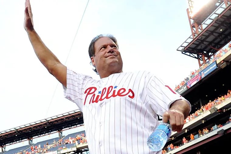Darren Daulton walks to the field during the Phillies alumni ceremonies before the start of a baseball game against the Atlanta Braves on Friday, Aug. 2, 2013, in Philadelphia. Daulton was recently diagnosed with a brain tumor. (Michel Perez/AP)