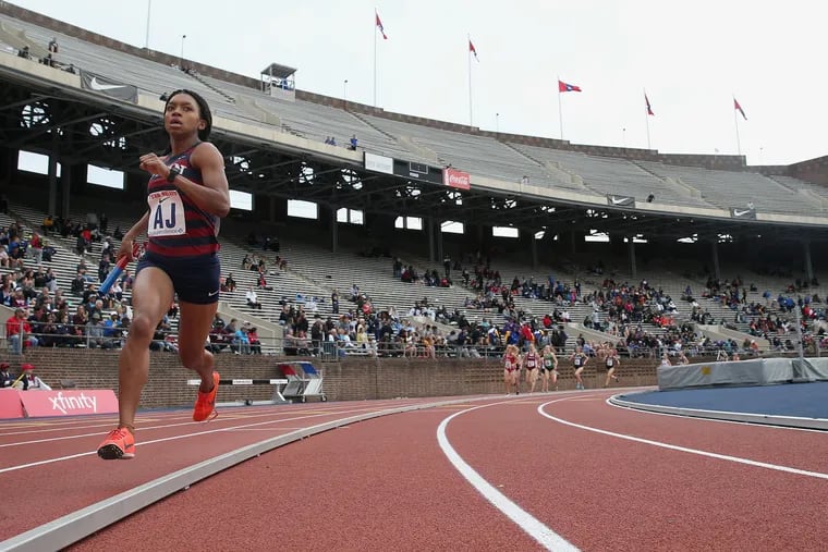 Penn's Nia Akins leads in the college women's distance medley championship during the 125th annual Penn Relays at Franklin Field in Philadelphia on Thursday, April 25, 2019. Penn won the event, setting a new Ivy League record.