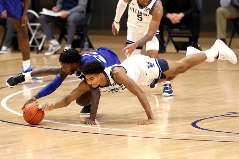 Jermaine Samuels, right, of Villanova and Myles Cale of Seton Hall go after a loose ball during the 1st half on Jan. 19, 2021 at the Finneran Pavilion at Villanova University.