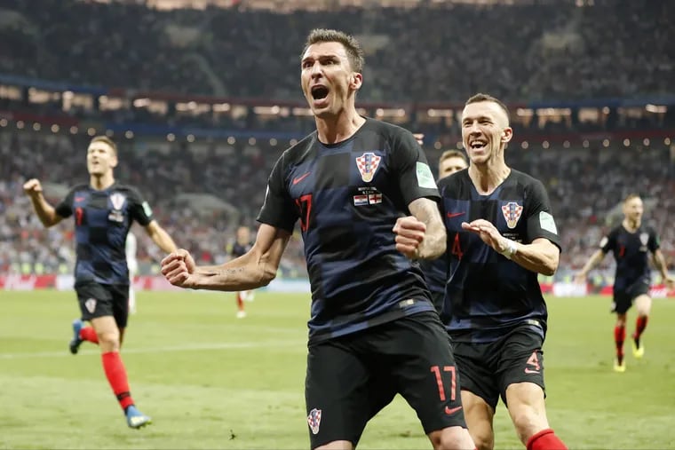 Croatia's Mario Mandzukic celebrates after scoring his second goal during the semifinal win over England. Croatia is underdogs again for Sunday's final against France.