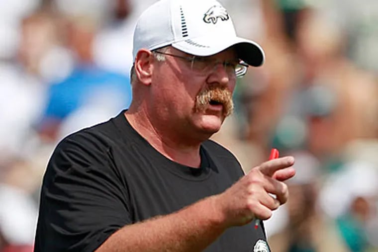 Andy Reid could end up with a surplus at some positions and a shortage at others. (Yong Kim/Staff Photographer)