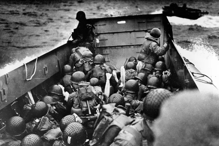 Seventy-one years ago, U.S. troops crouch down in a landing craft as they approach Omaha Beach. These troops came from everywhere — from farmlands to factories to banks.