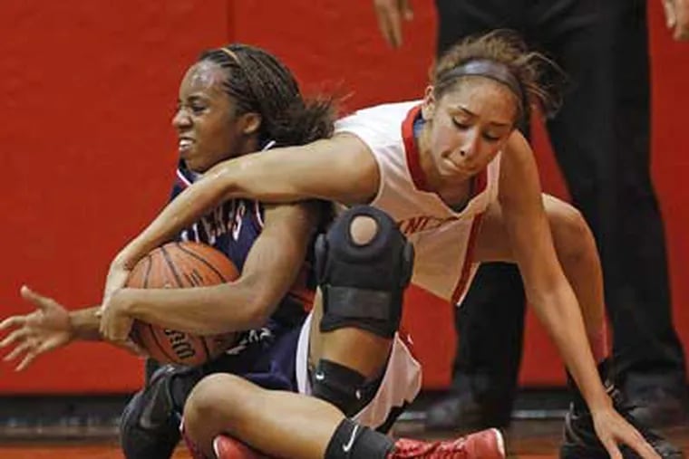 Rancocas Valley's Natalya Lee tries for a steal on Willingboro's
Aaliya Saud-Lewis. (Ron Cortes / Staff Photographer)