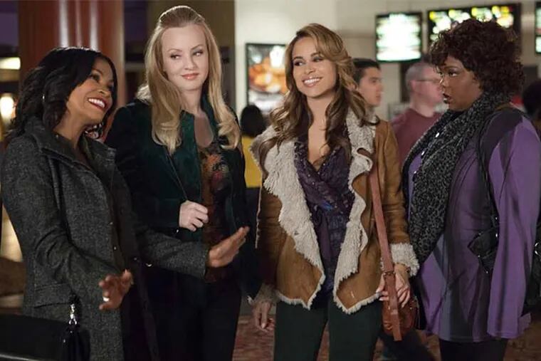 Nia Long, Wendi McLendon-Covey, Zulay Henao, and Cocoa Brown (from left) star in "Tyler Perry's The Single Moms Club."