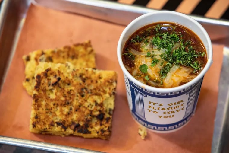 PBR Beef Chili, served in a New York City-style takeout coffee cup, is on the menu at Wine Dive.