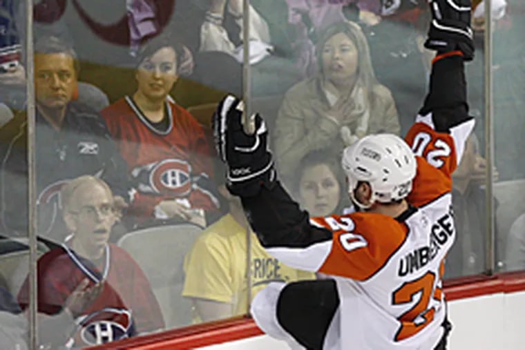 The Flyers' R.J. Umberger faces the crowd as he celebrates his goal against the Canadiens during the first period of Game 5 in the Eastern Conference semifinals. (AP Photo/The Canadian Press, Paul Chiasson)