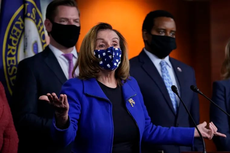 House Speaker Nancy Pelosi of Calif., with impeachment managers Rep. Eric Swalwell, D-Calif., and Rep. Joe Neguse, D-Colo.