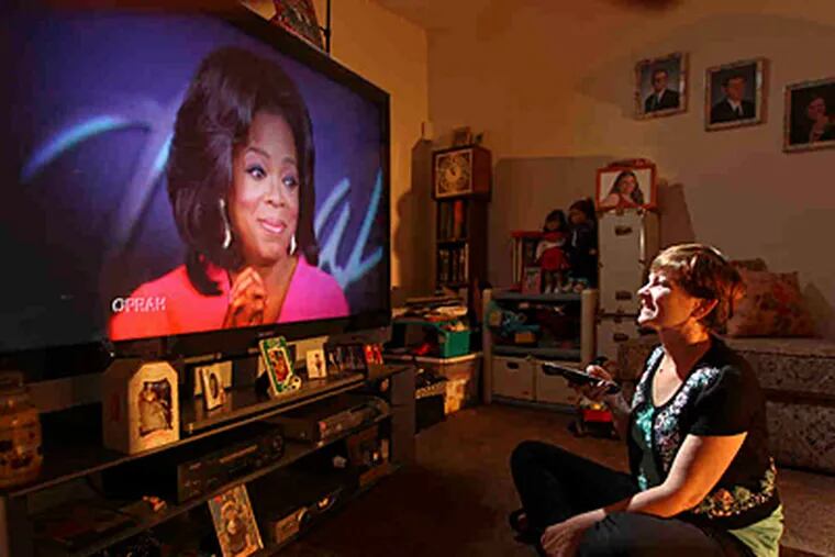 Elaine Brigandi, who lives in Glassboro, N.J, watches Oprah religiously every day. She even went to the taping of the final show in Chicago last week. ( Michael Bryant / Staff photographer )