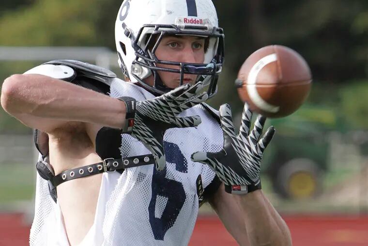 Episcopal Academy tight end Evan Butts catches a pass during practice. (STEVEN M. FALK / Staff Photographer)
