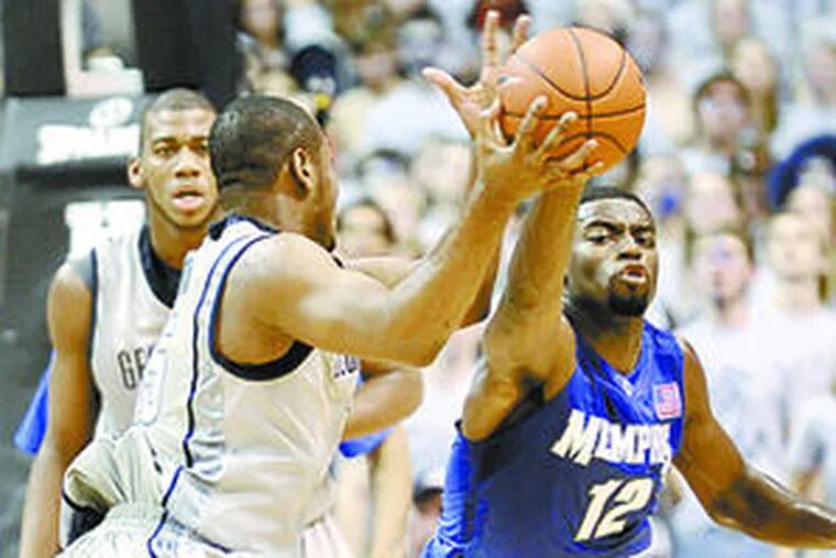 The Chester native (right) skirmishes with Georgetown&#0039;s Austin Freeman.