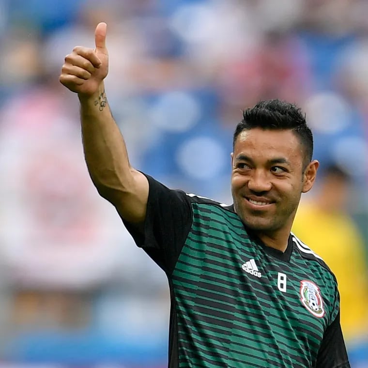 Mexico's Marco Fabian greets supporters during warmups before a 2018 FIFA World Cup game.