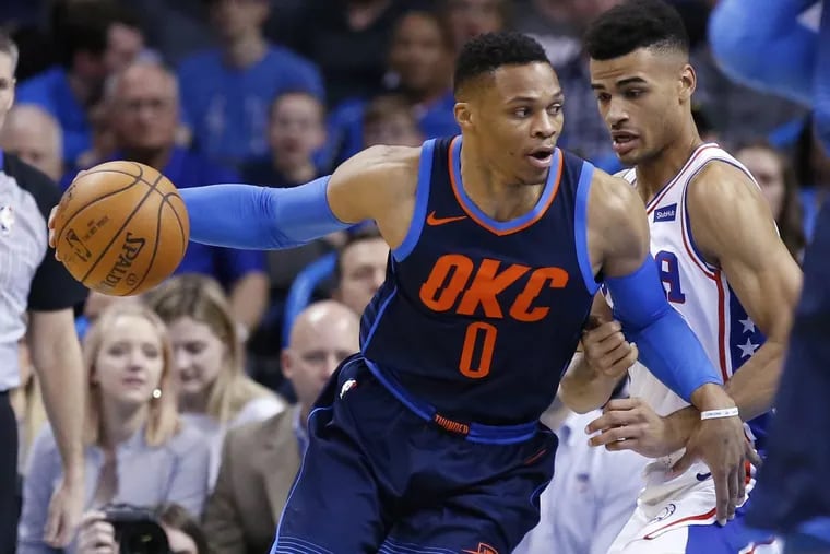 Thunder guard Russell Westbrook (left) drives around Sixers guard Timothe Luwawu-Cabarrot, during the Sixers’ loss on Sunday.