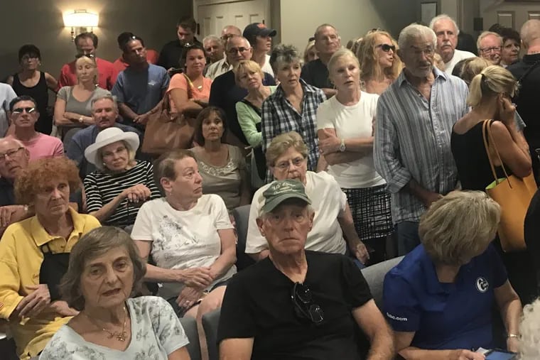 Residents in Margate turn out for a meeting in which commissioners voted to seek a court injunction to block the dune project they say is destroying their beaches.
