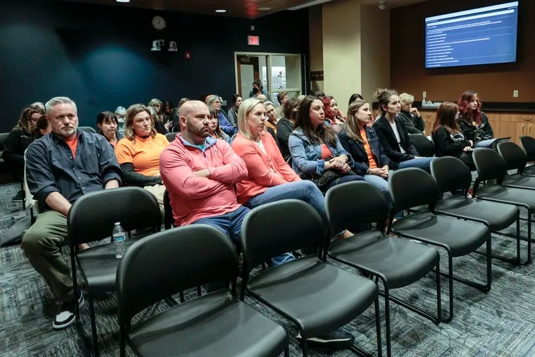 Lower Merion school district parents upset with the district's handling of an incident involving Bala Cynwyd fifth graders texting about school shootings attend the school board meeting Monday.
