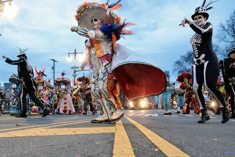 Joe Pomante (center) and the Durning String Band perform at S. Broad and Carpenter St. during the Mummers Parade in Phila., Pa. on Jan. 2, 2022.