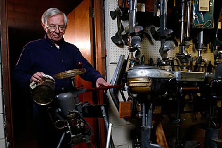 Bob Grubb polishes a 1910 Waterman 2 horsepower engine. ( Michael S. Wirtz /  Staff ).