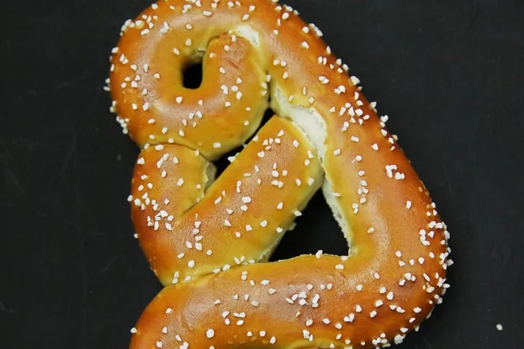 The Tebow pretzel shows the QB's praying posture. (Michael Bryant/Staff Photographer)