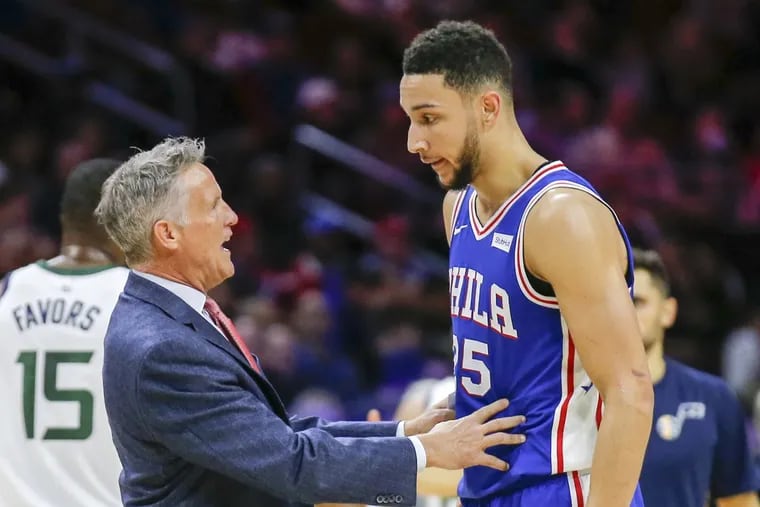 Sixers coach Brett Brown chatting with Ben Simmons during a November game.
