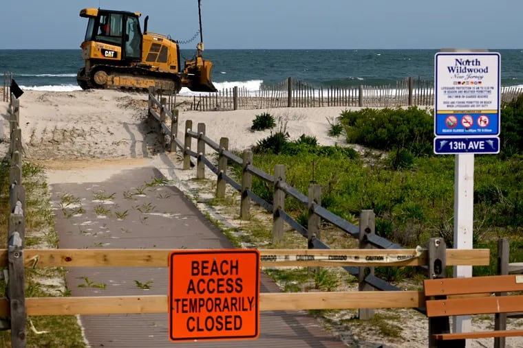 Work continues on an eroded section of beach in North Wildwood. The Shore town received emergency permission from state officials to repair damaged dunes before the Memorial Day weekend, the start of the summer tourism season.