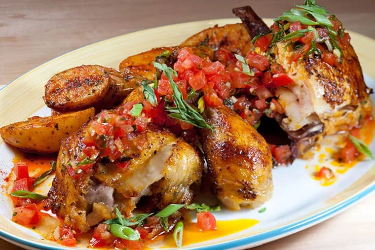 Pollo a la brasa, among the most flavorful birds in town, as served at Rosa Blanca.