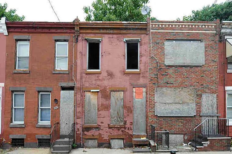 The 2300 block of Gerritt Street in Point Breeze includes three vacant houses. The city's lack of an efficient system for dealing with abandoned, tax-delinquent properties means such sites often remain festering for many years. In other cities, they would be cleared off within as little as a year.